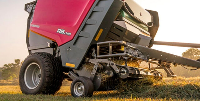 Hesston by Massey Ferguson 1 Series Round Balers tractor in a field